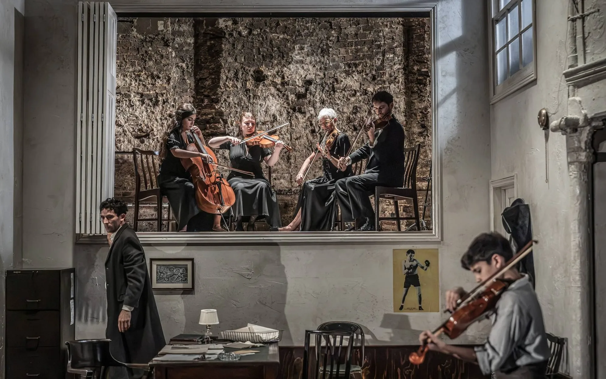The on-stage string quartet framed above the Bonaparte apartment, Golden Boy at the Almeida Theatre